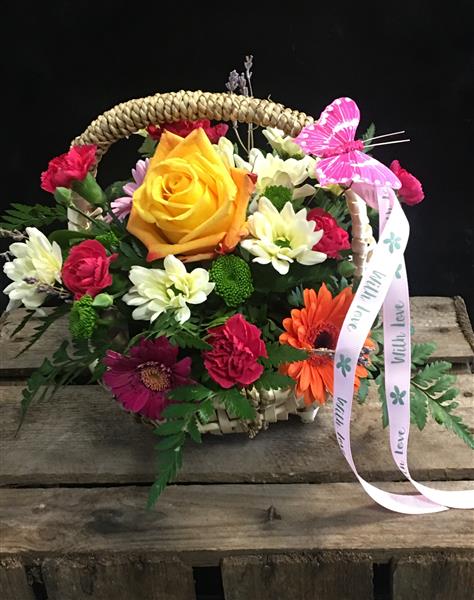 Margaret Raymond Florist vibrant wicker basket